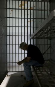 prisoner in cell.jpg